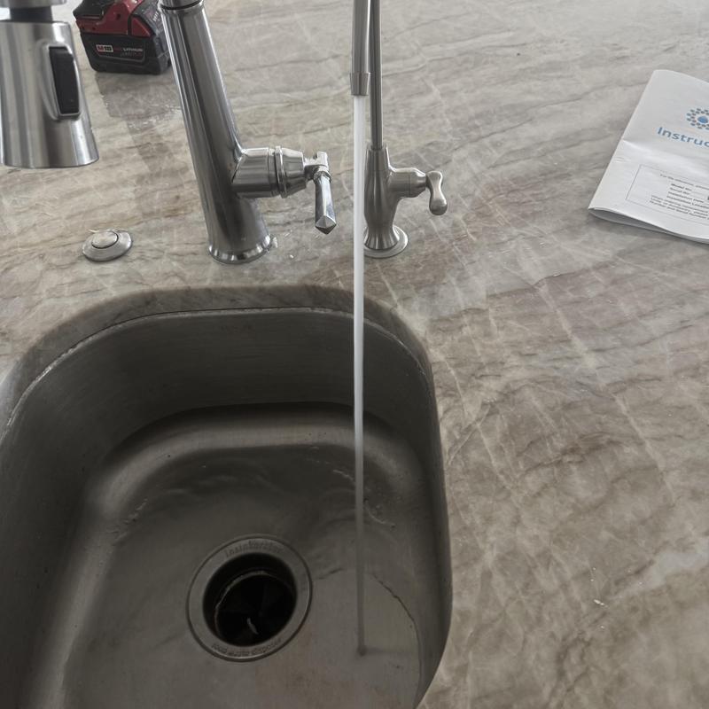 RO system faucet with running water in kitchen sink