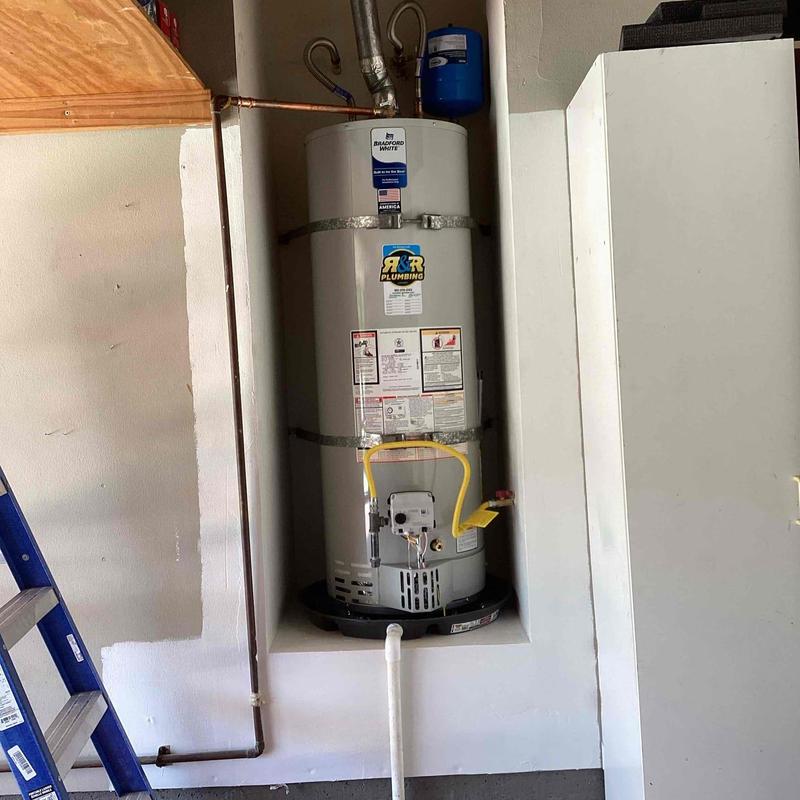 Gas water heater with piping and vent installation