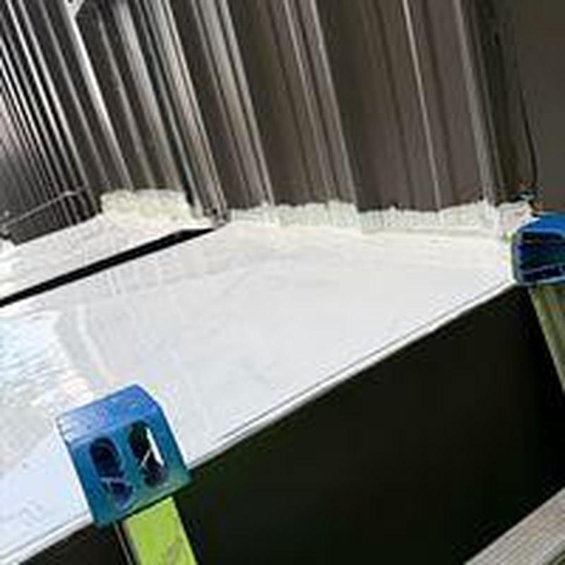 Commercial metal roofing with new sealant application Commercial metal roofing with new sealant application
