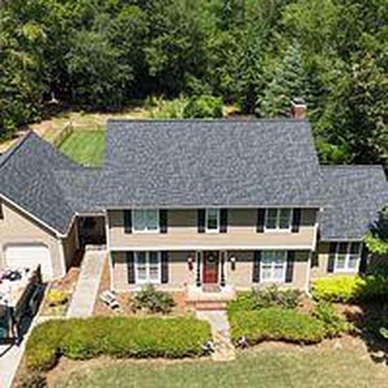Asphalt shingle roof replacement on suburban home Asphalt shingle roof replacement on suburban home