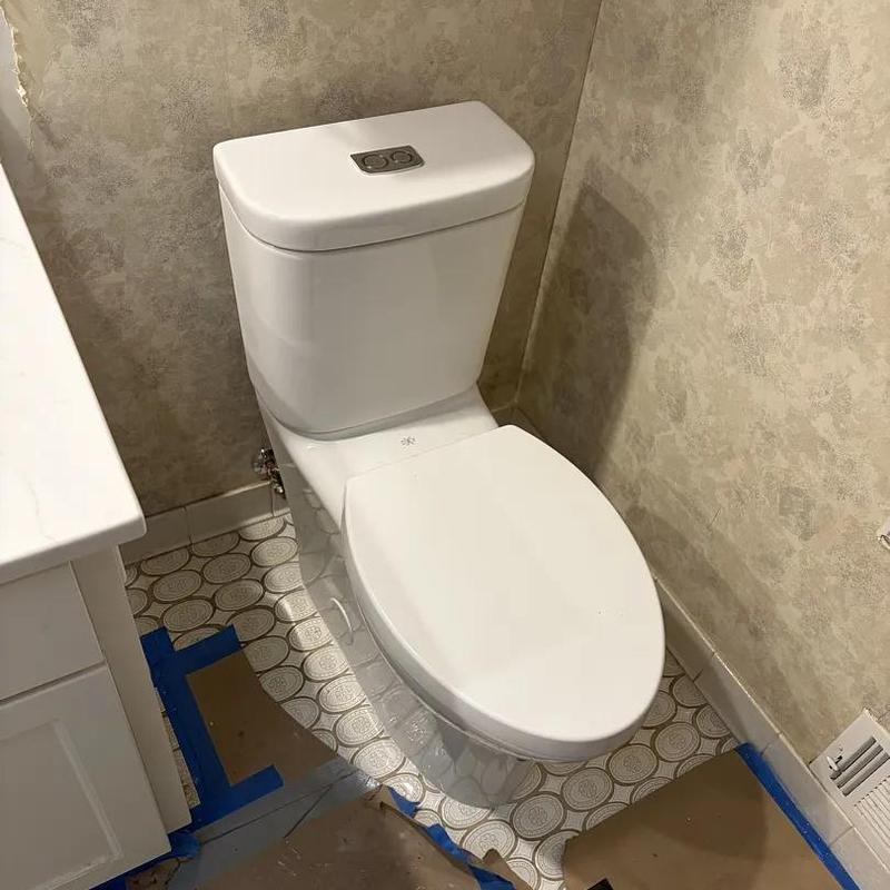 Toilet installation in bathroom plumbing remodel