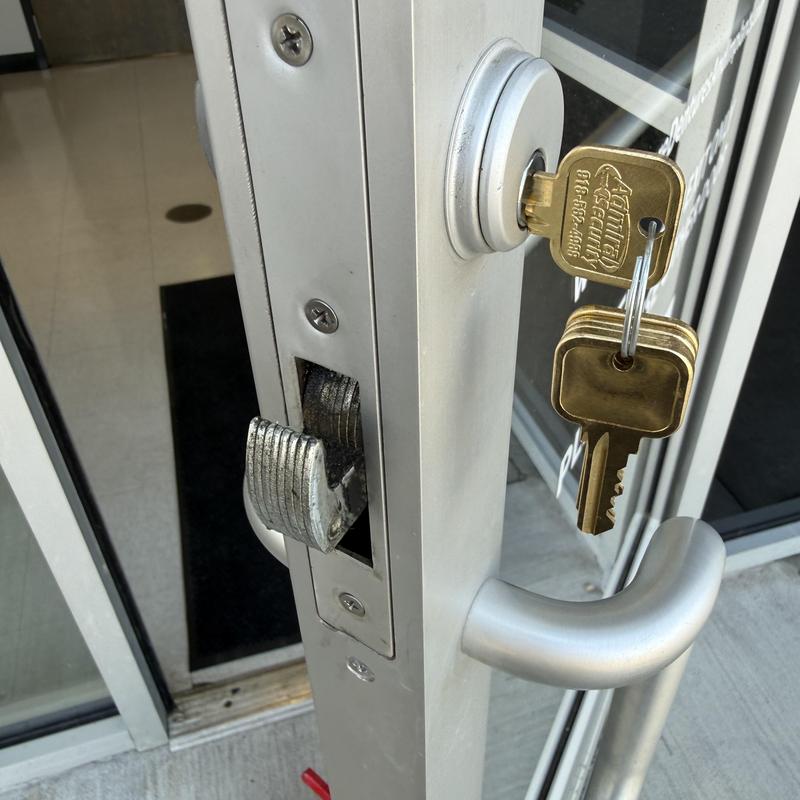 Exit device latch and door lock with keys on commercial door Exit device latch and door lock with keys on commercial door