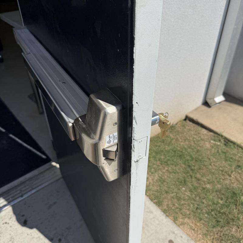Exit device with key cylinder on metal door Exit device with key cylinder on metal door
