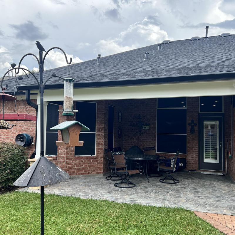 Seamless aluminum gutters installed on patio roofline