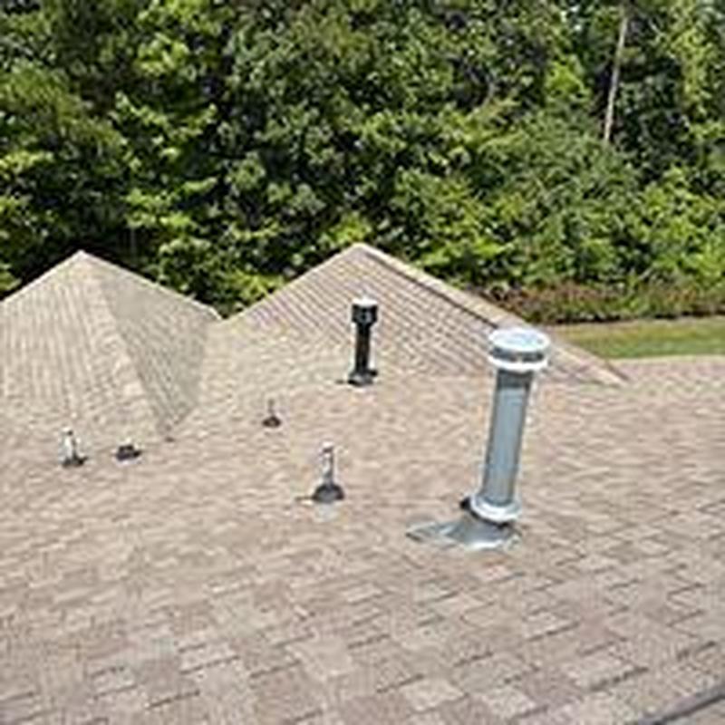 Asphalt shingle roof with new vent pipe flashing Asphalt shingle roof with new vent pipe flashing