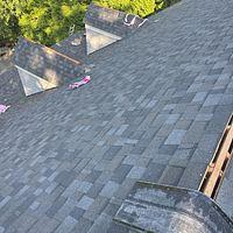 Asphalt shingle roof installation with nearby dormers Asphalt shingle roof installation with nearby dormers