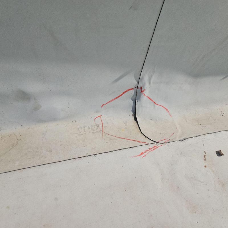 T.P.O. Roof membrane with marked seam damage