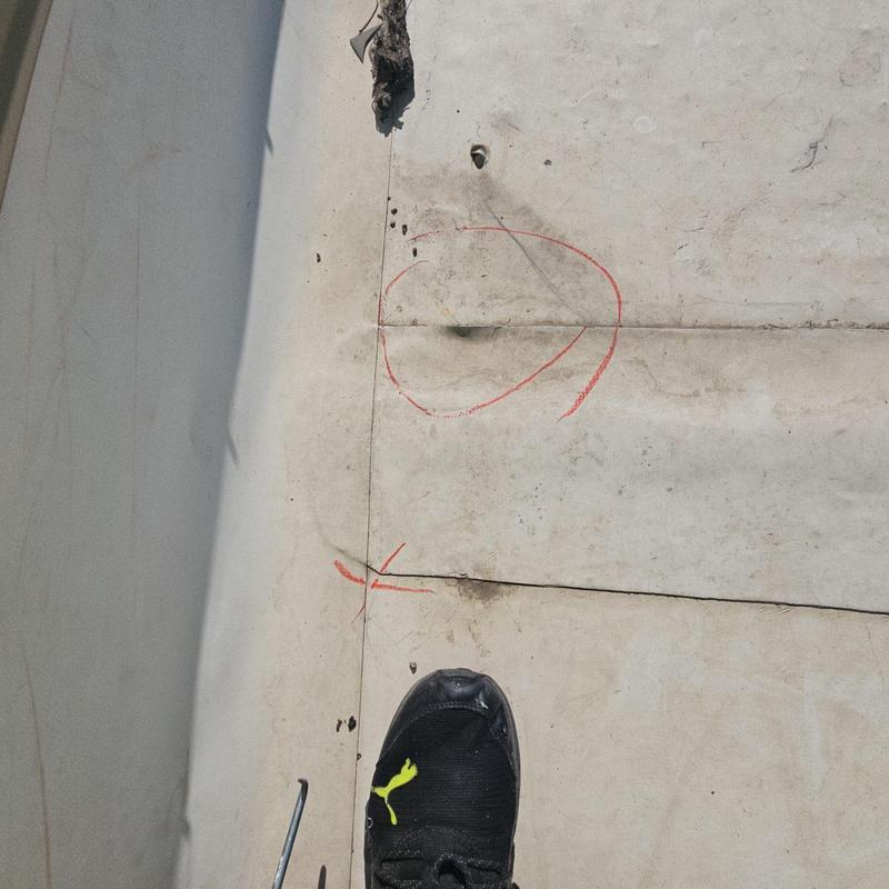 TPO flat roof with marked loose seams for repair