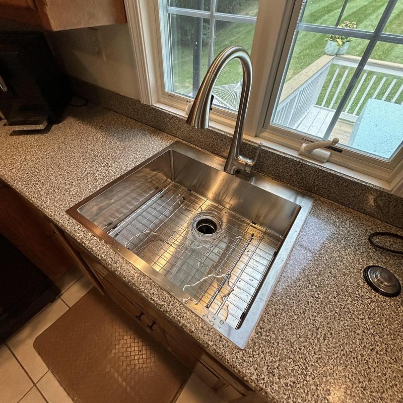 Kitchen sink and faucet installation near window Kitchen sink and faucet installation near window