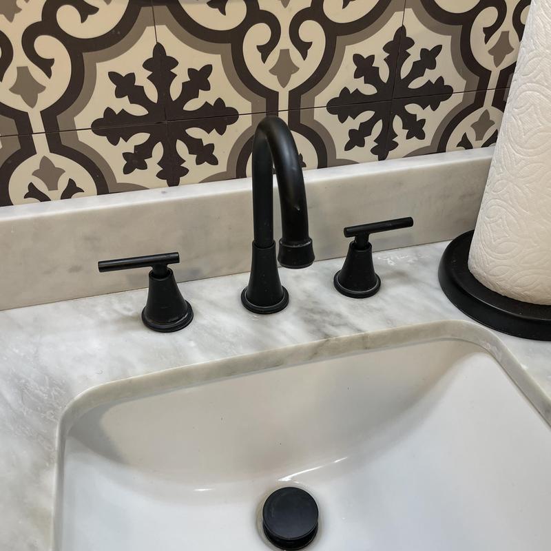 Two-handle widespread bathroom faucet with pop-up drain