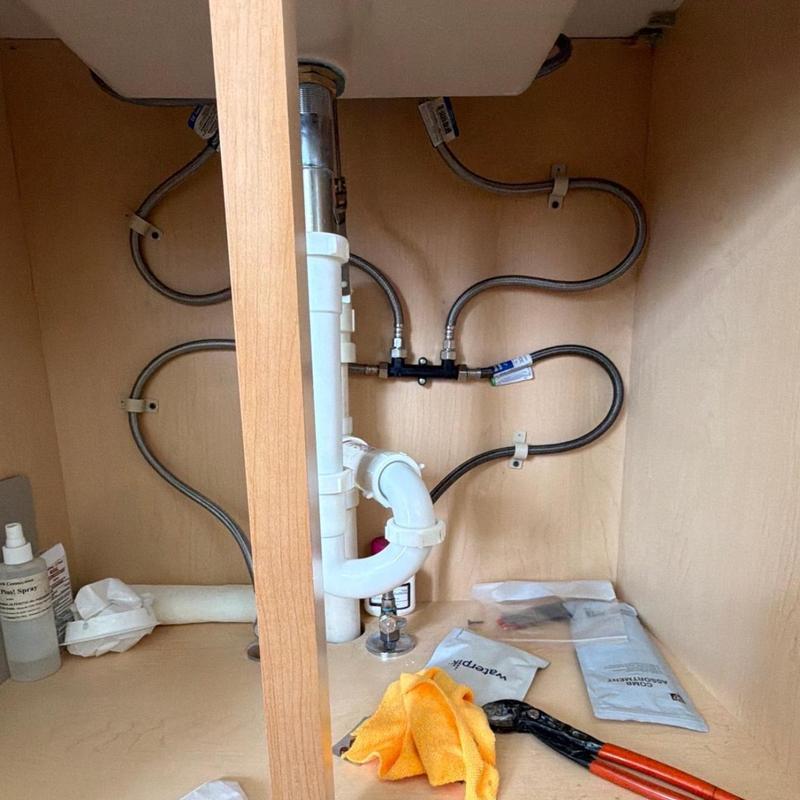 Recirculation pump and pipeline crossover installation under sink Recirculation pump and pipeline crossover installation under sink