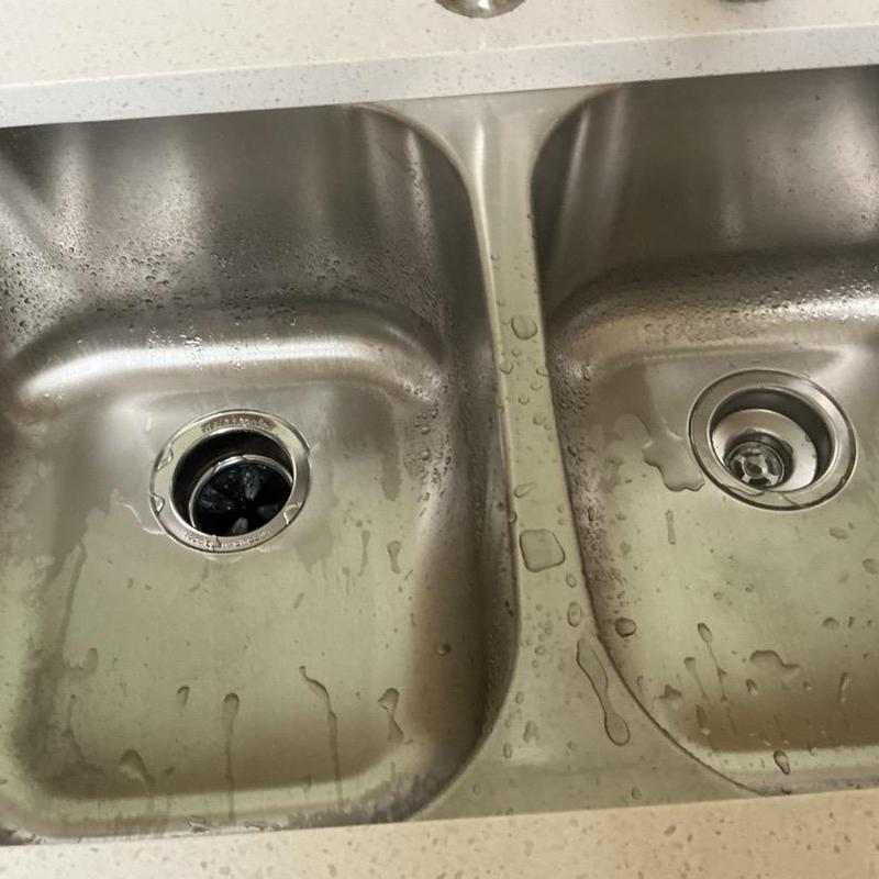 Double bowl kitchen sink with disposal kit installed