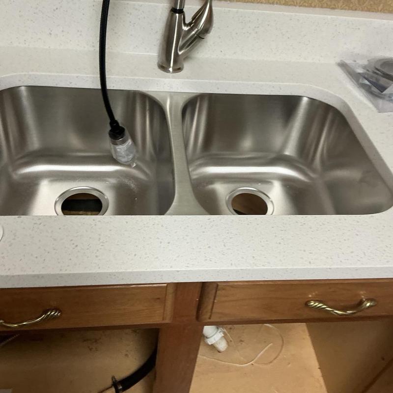Double bowl kitchen sink with disposal setup