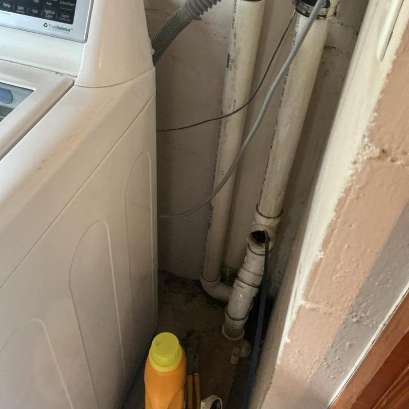 Cast iron sewer pipe collapse near washing machine