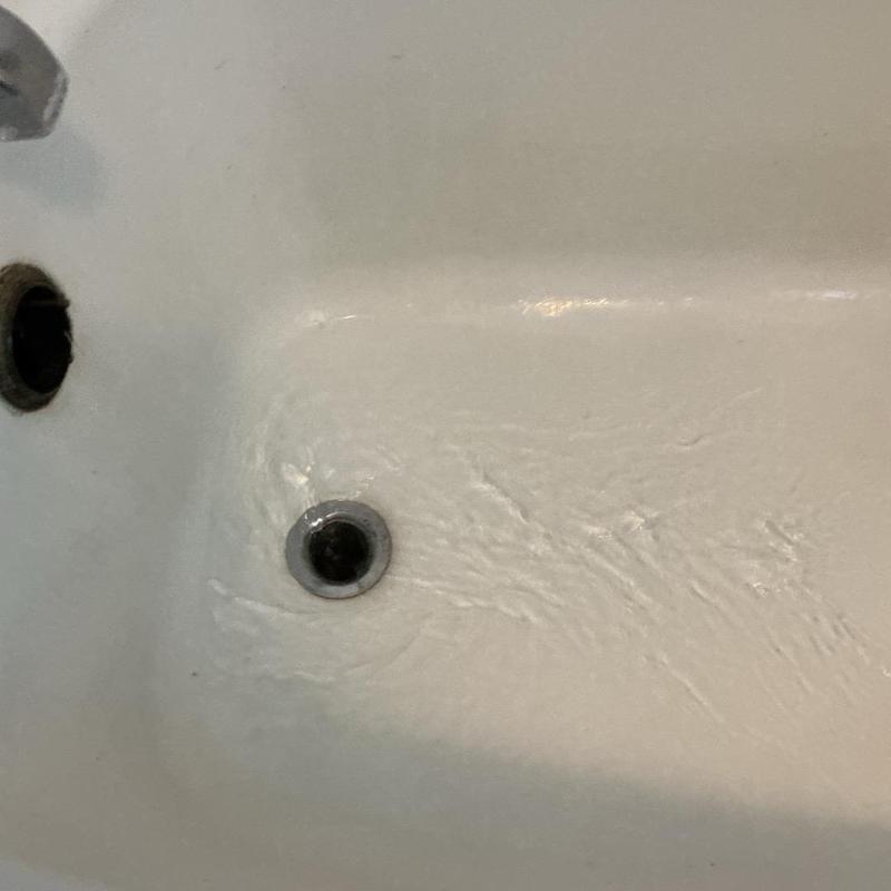 Bathtub drain clearing with water flow in upstairs bathroom
