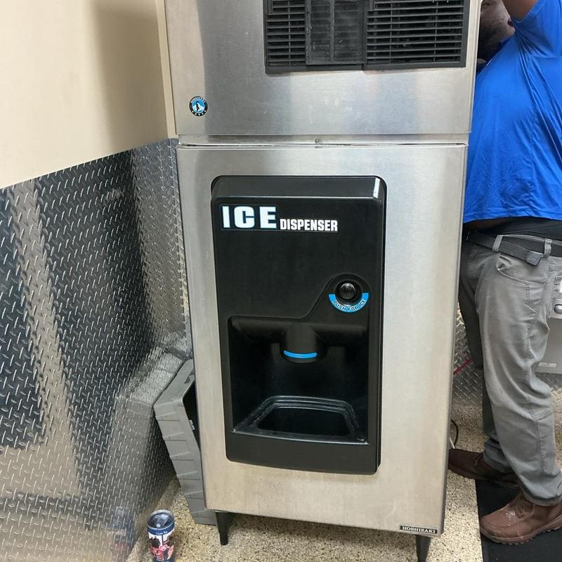 Ice dispenser and urinals with auger clearing
