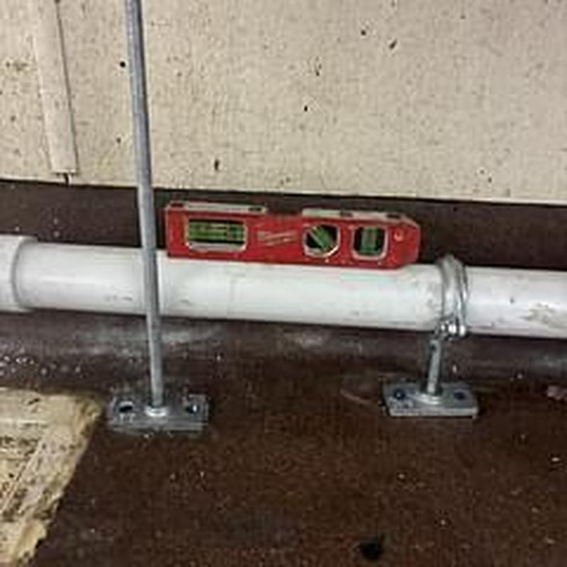 Lever drain discharge pipe with level tool installation Lever drain discharge pipe with level tool installation
