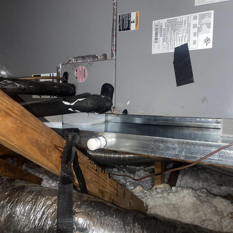 Secondary drain pan installation on HVAC unit in attic