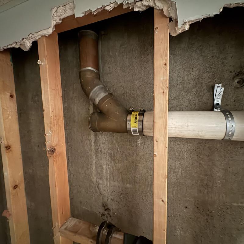 3 inch PVC drain pipe with metal coupling installation