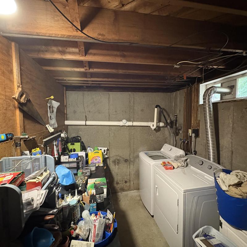 3 inch PVC drain pipe installation in basement laundry room