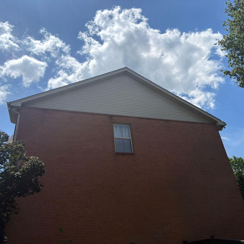 Roof shingles with hail damage on residential home