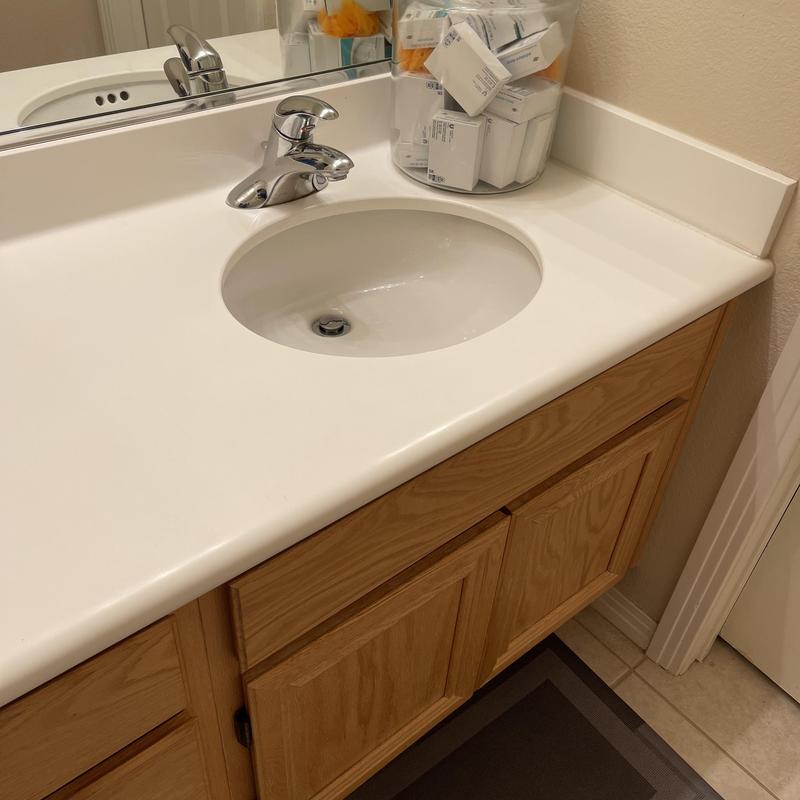Bathroom sink and countertop with new caulking
