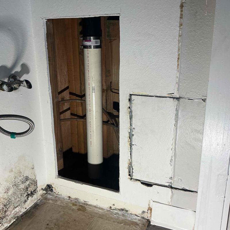 Cast iron sewer branch pipe replacement in wall cavity