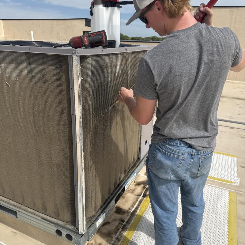 Commercial condenser coil cleaning on rooftop unit Commercial condenser coil cleaning on rooftop unit