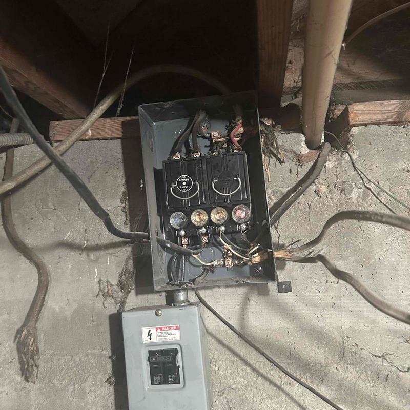 Old electrical tube panel with exposed wiring in basement Old electrical tube panel with exposed wiring in basement