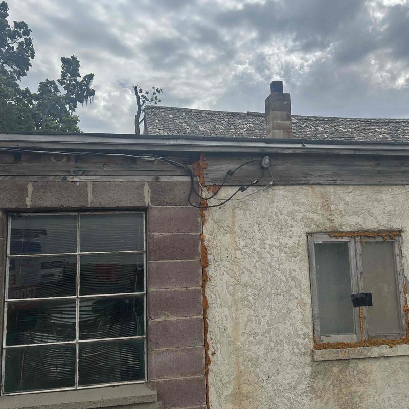Overhead service powerlines and exterior wall wiring Overhead service powerlines and exterior wall wiring