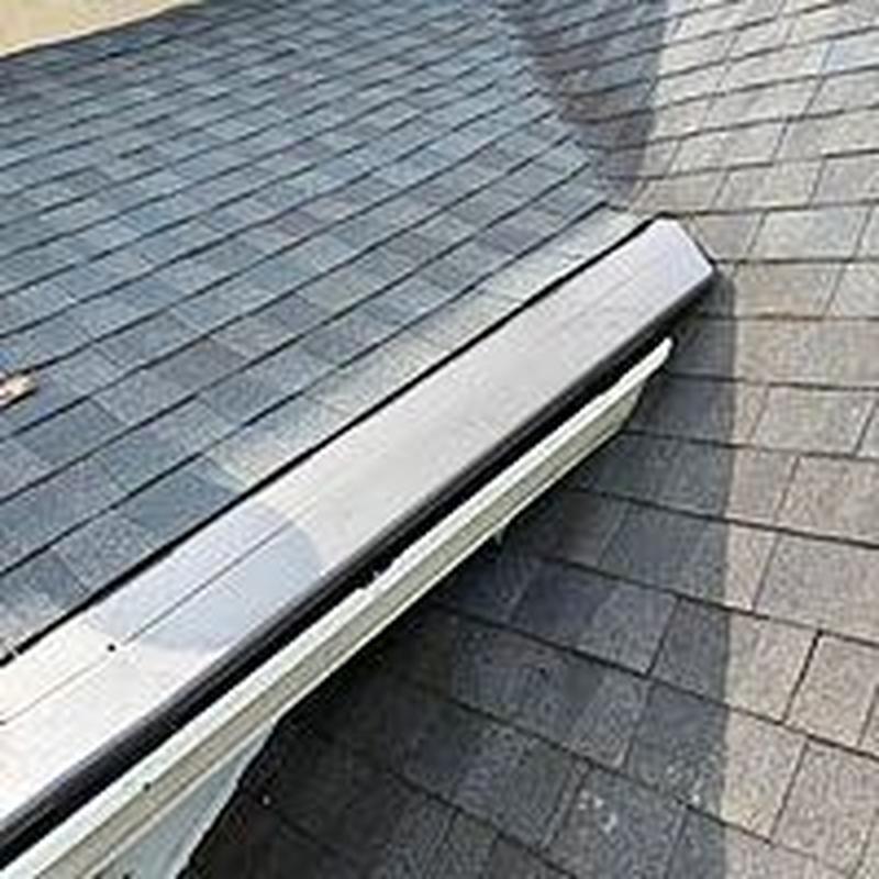 Asphalt shingle roof with repaired flashing detail Asphalt shingle roof with repaired flashing detail