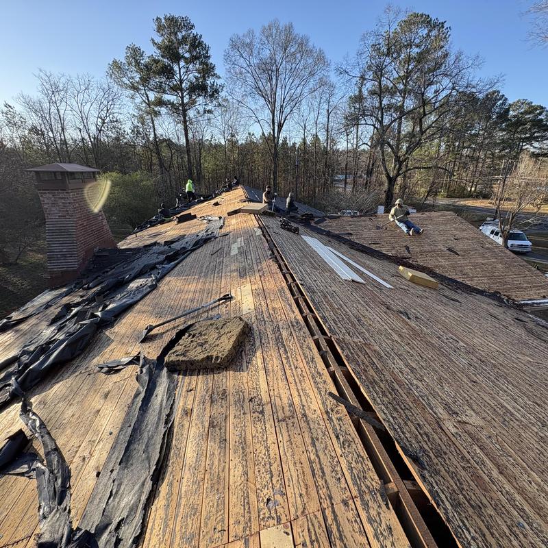 Roof decking stripped with workers on site in Rome, GA Roof decking stripped with workers on site in Rome, GA
