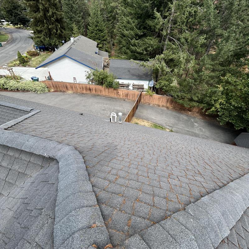 Asphalt shingle roof showing valley and ridge detail Asphalt shingle roof showing valley and ridge detail