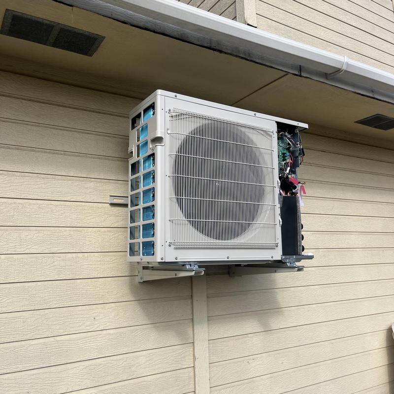 Mitsubishi Hyper Heat outdoor unit installed on wall Mitsubishi Hyper Heat outdoor unit installed on wall