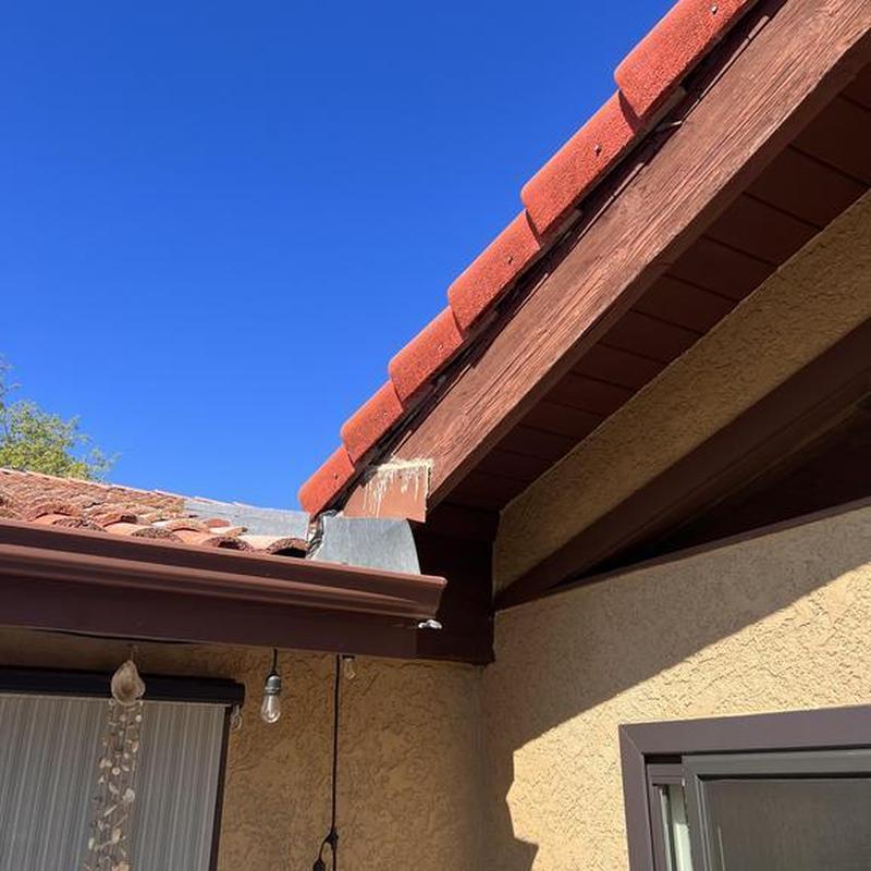 Tile roof edge with flashing and gutter in Sonora CA