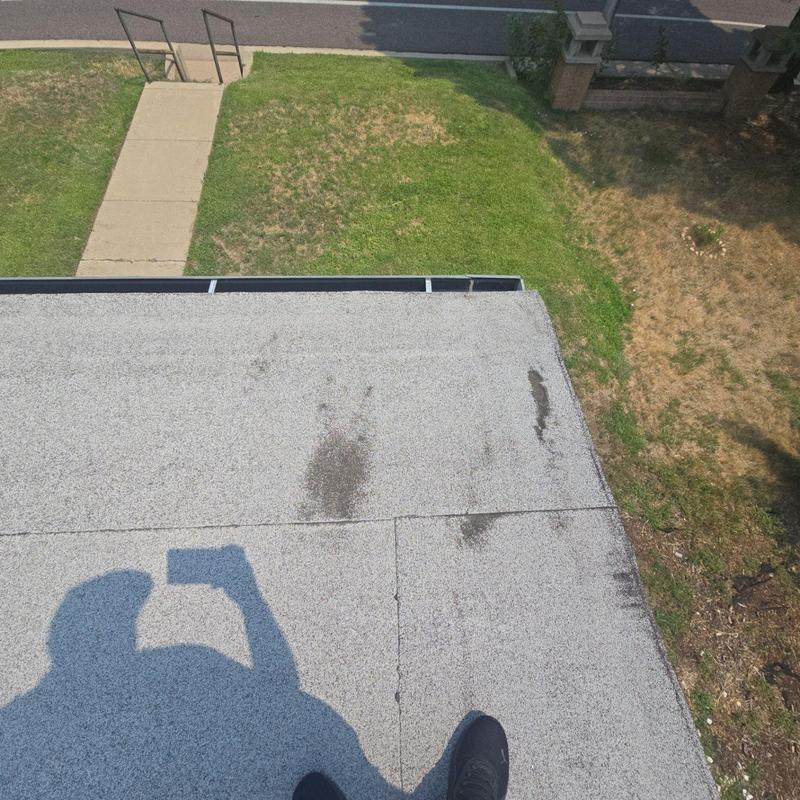 Flat roof with hail damage and wear marks Flat roof with hail damage and wear marks