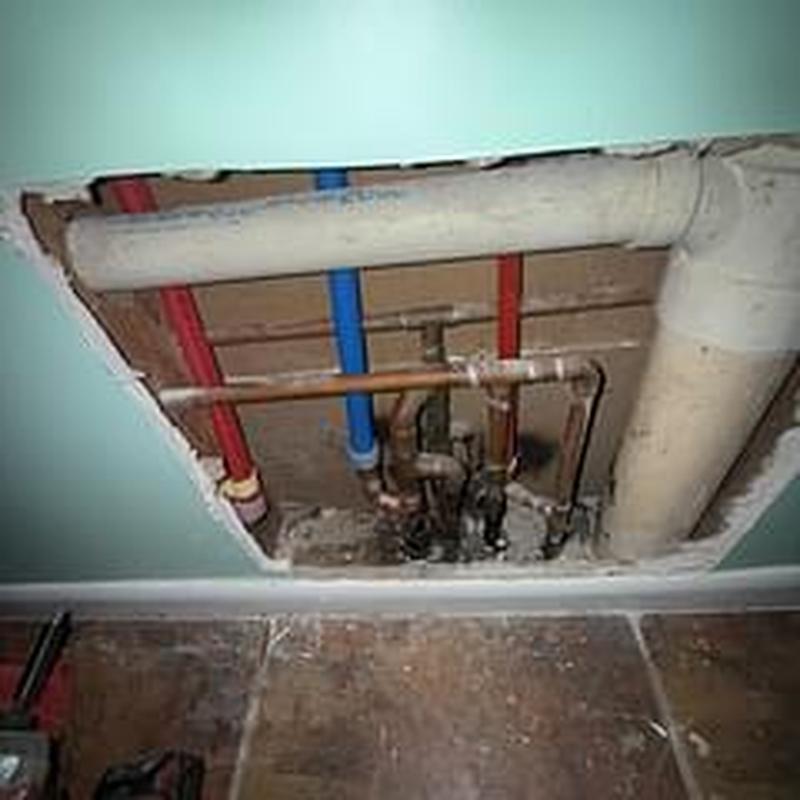 Copper and PEX water lines with plumbing manifold in wall cavity