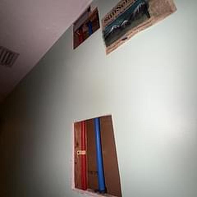 Pex water supply lines in wall cavity exposed