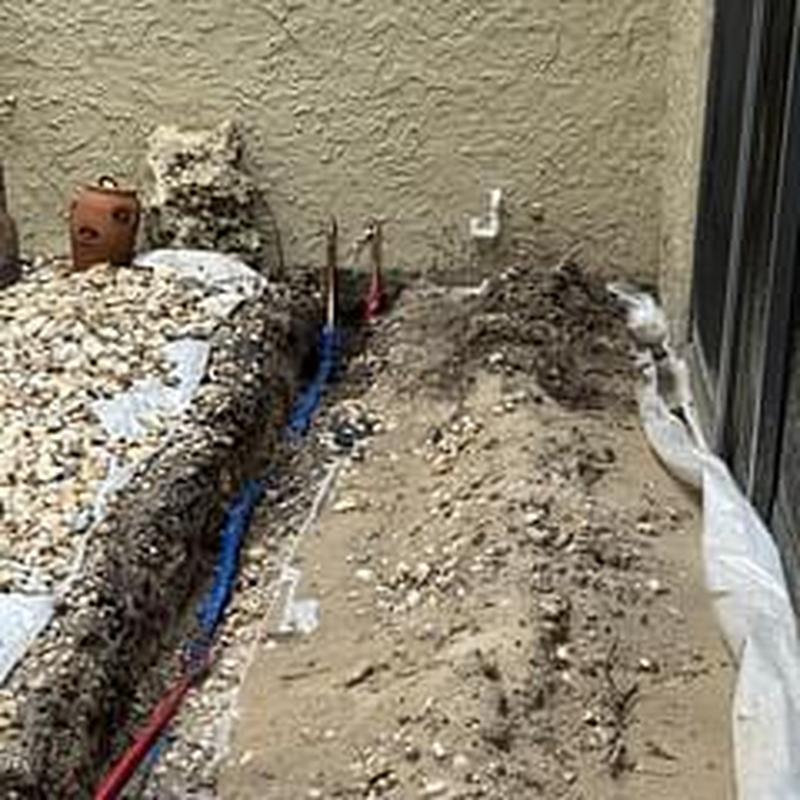 34 copper water lines trench beside home exterior wall