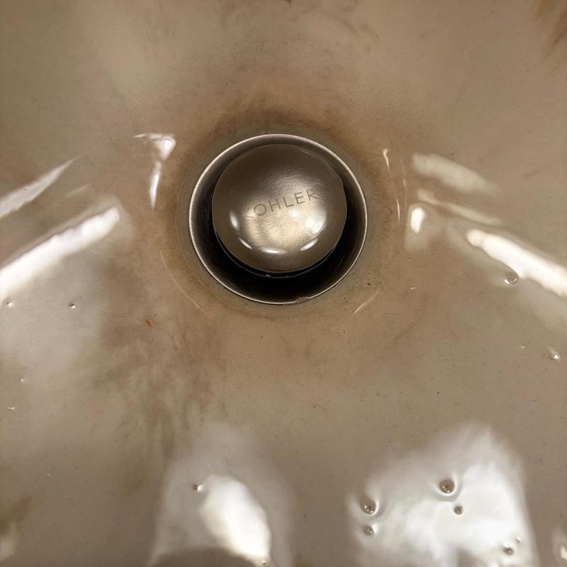 Vanity sink Kohler stopper in dirty basin