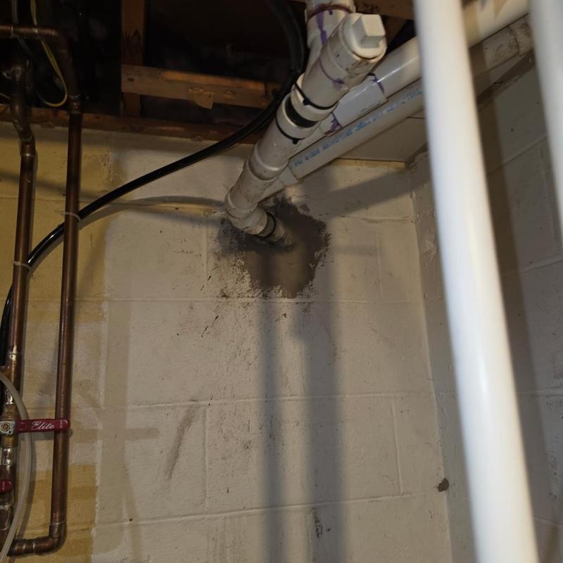 PVC sewer pipe replacing cast iron pipe in basement