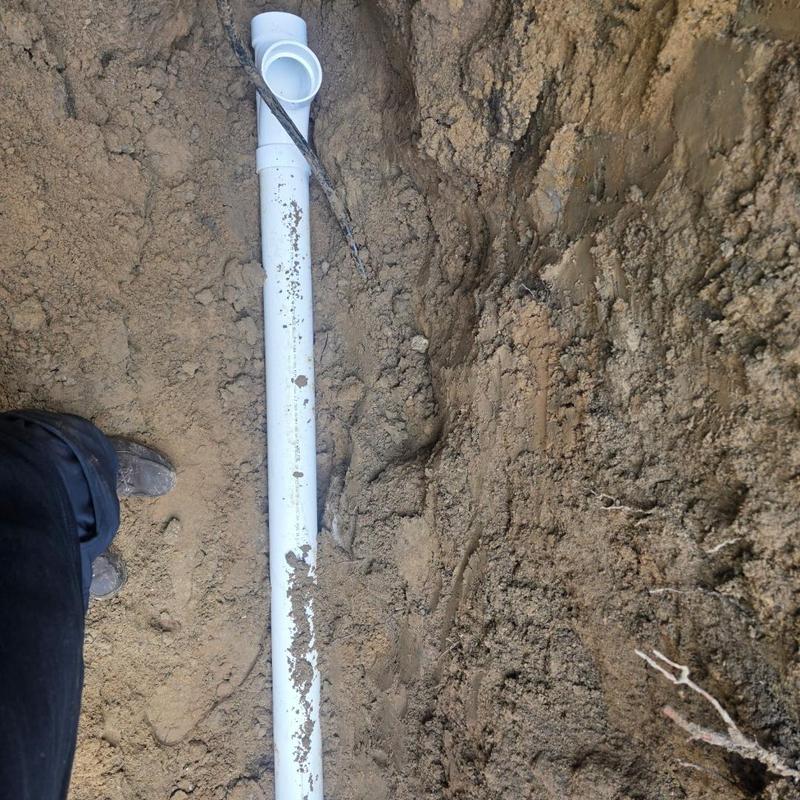Sewer pipe replacement through house foundation and yard