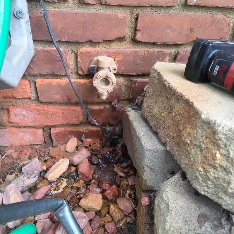 Frost-free hose bib installation on brick wall