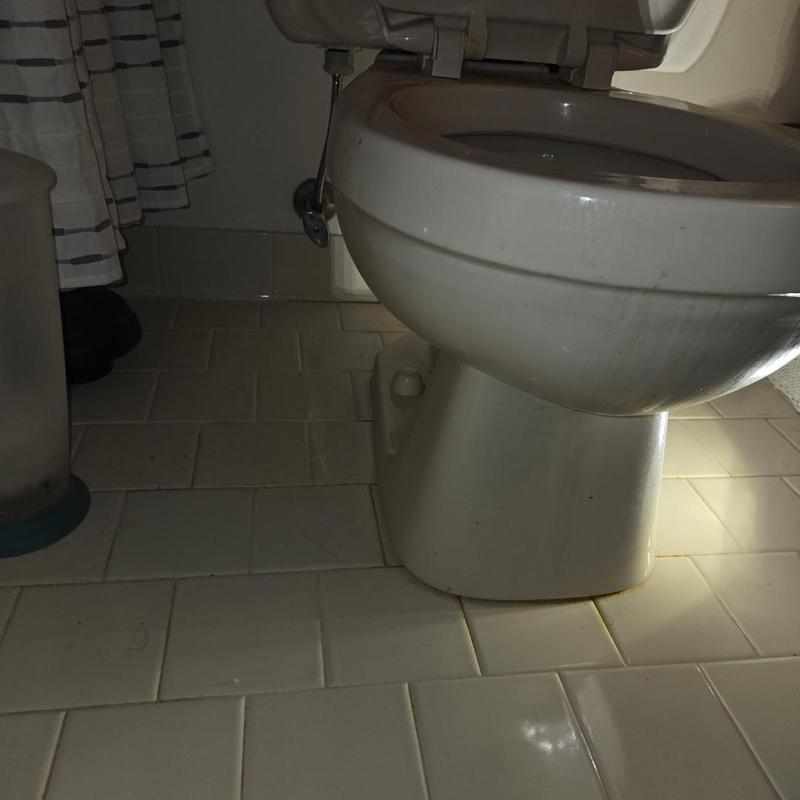 Toilet bowl replacement with tiled bathroom floor