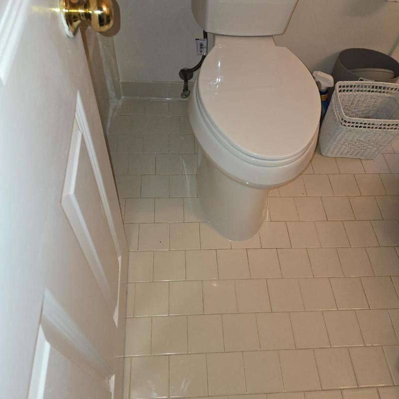 Toilet replacement in small tiled bathroom restroom