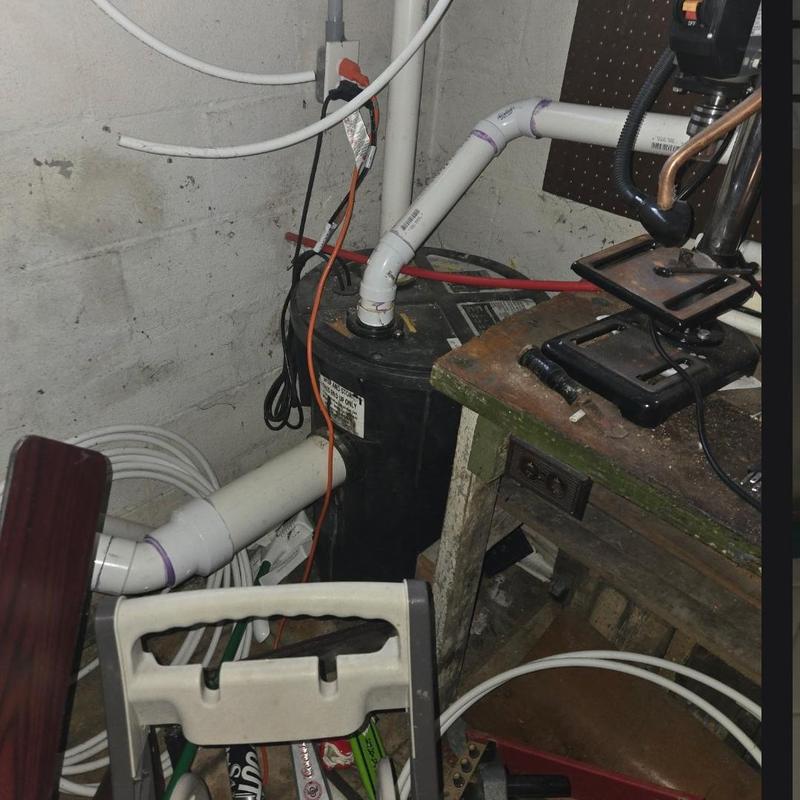Sump pump system with PVC piping and check valve installation
