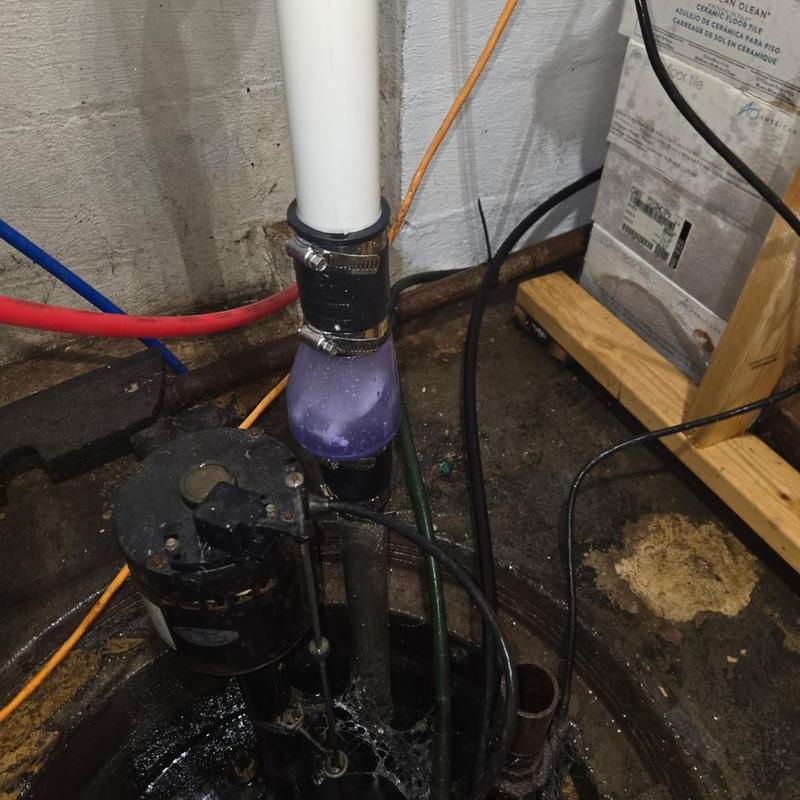 Sump pump check valve installation with cable reset