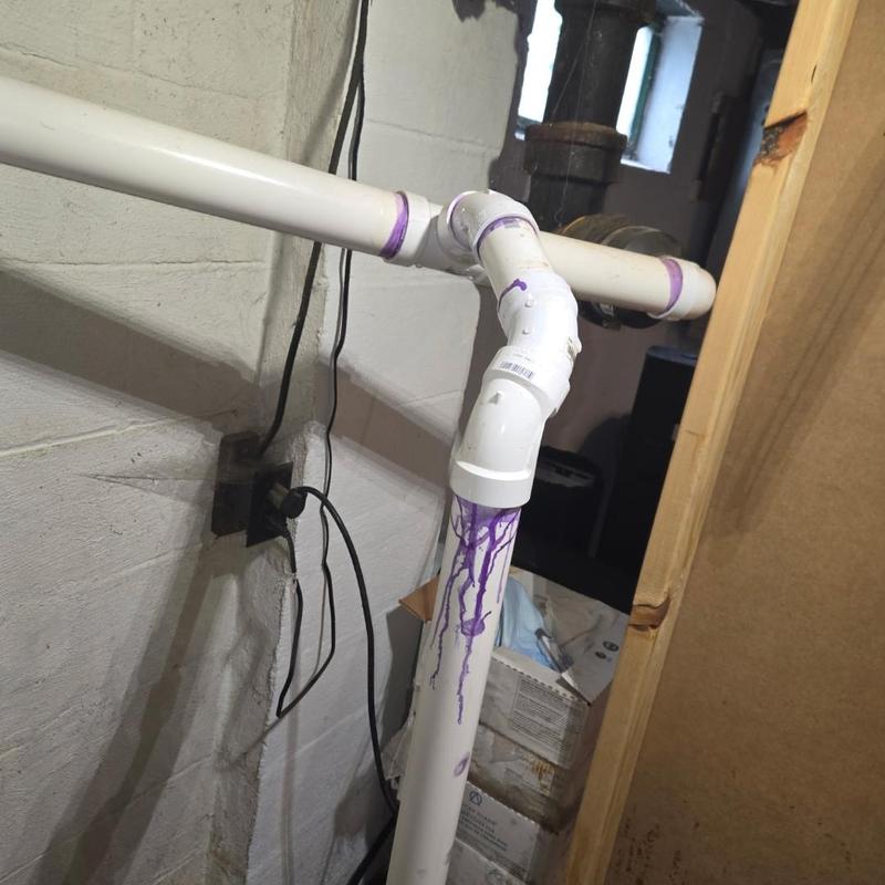 Sump pump check valve and PVC piping installation
