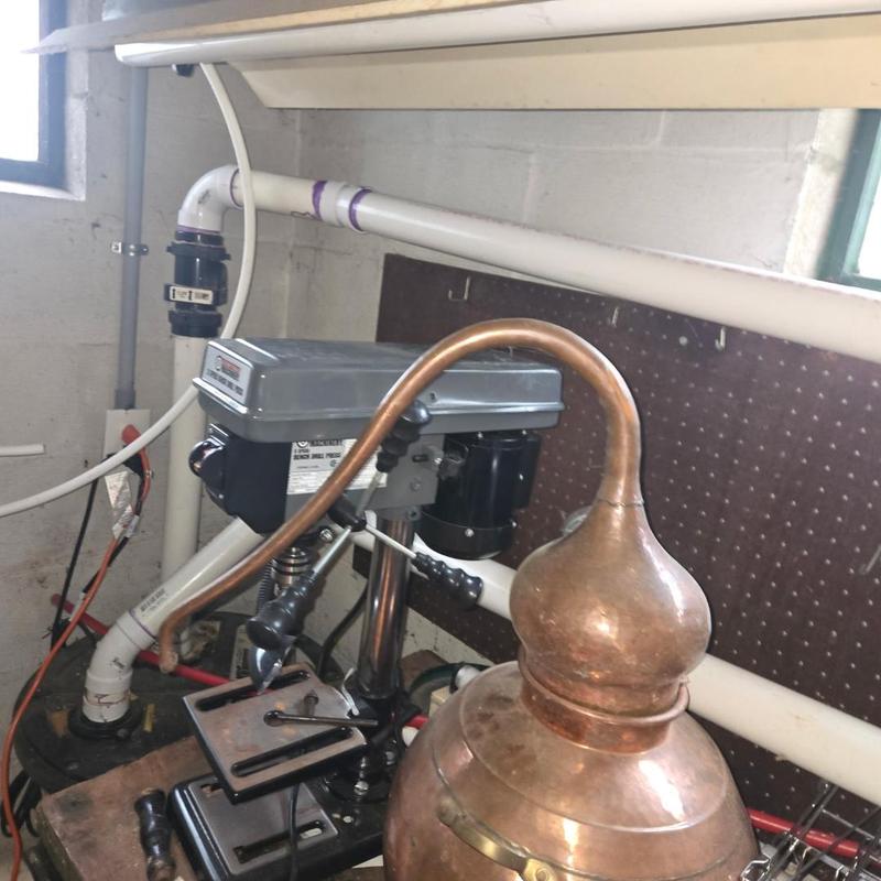 Sump pump check valve and cable main installation