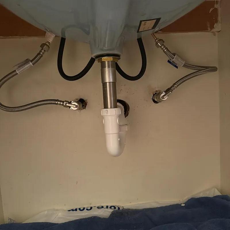 Kitchen sink drain and water supply lines installation